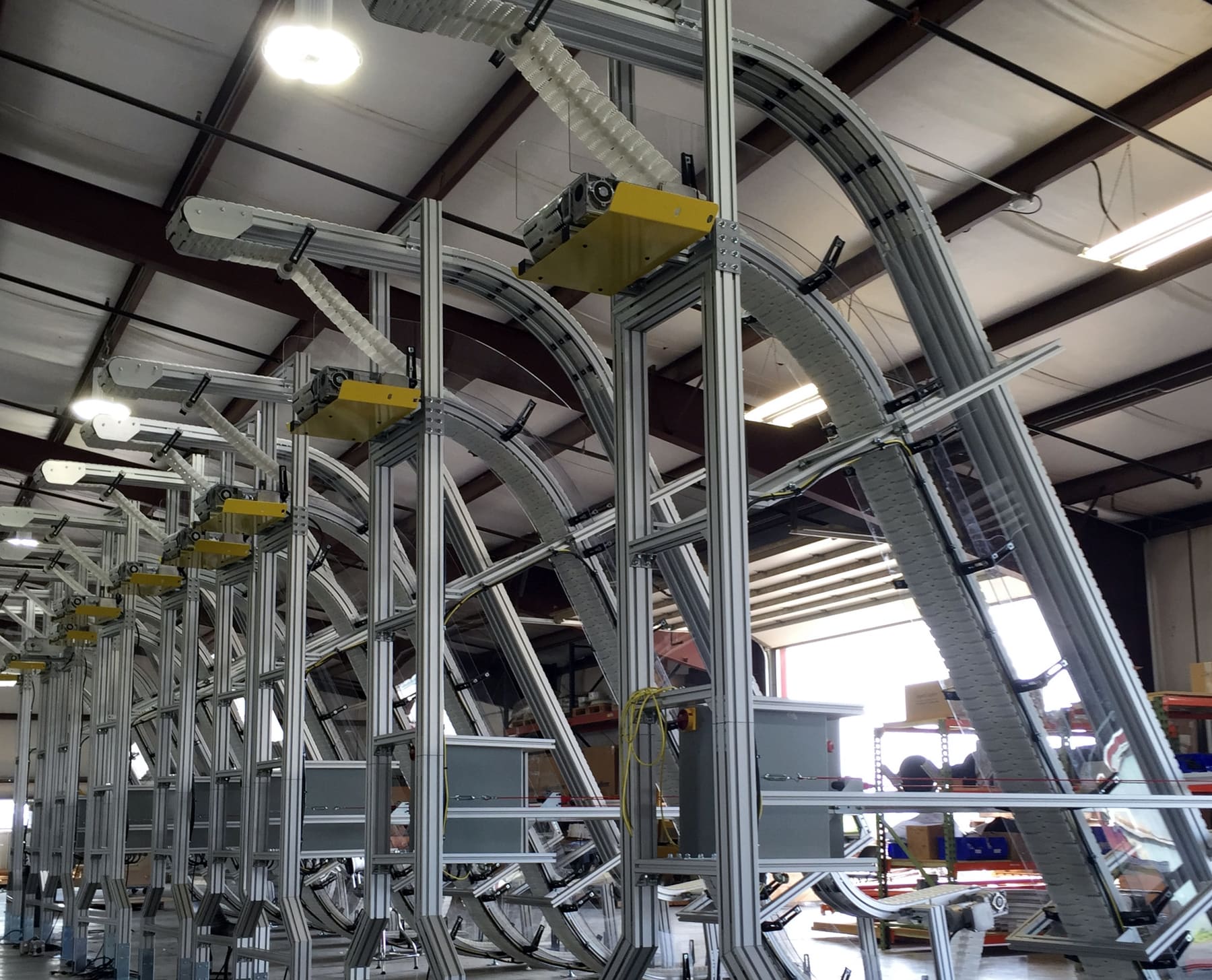Top grip conveyors